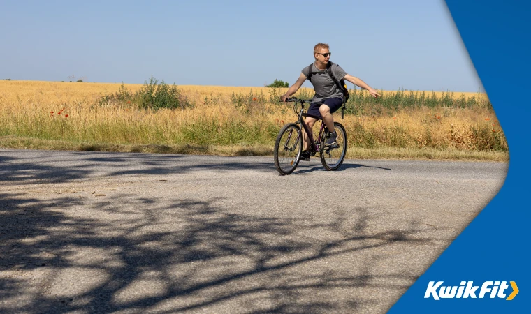 indicating cyclist on the road